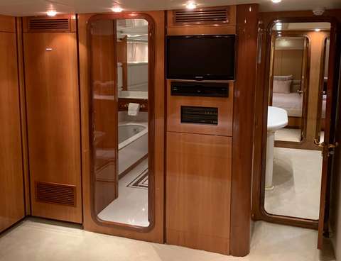 yacht interior showing black plastic tv screen on wall