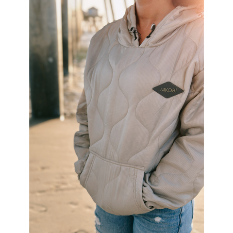 Close up of Outdoorsy AF hoodie on the beach