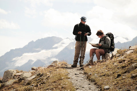 Two backpackers looking at a map