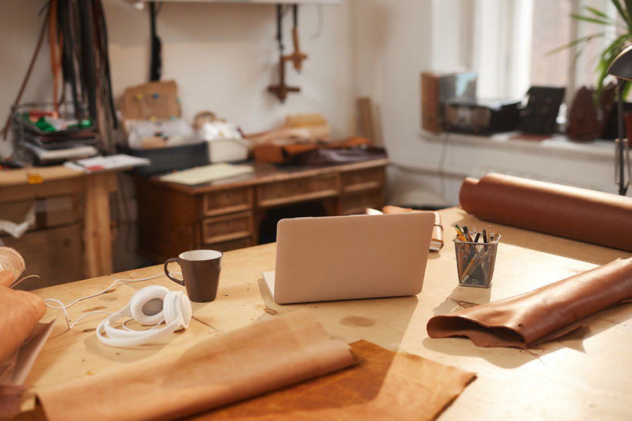 a desk with various craft materials on it