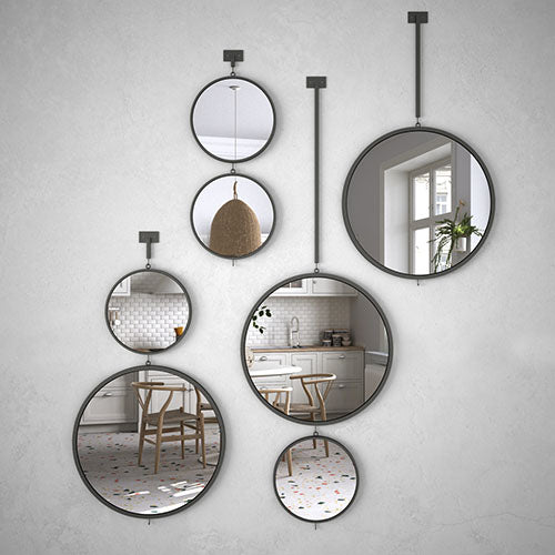 round mirrors hang wall