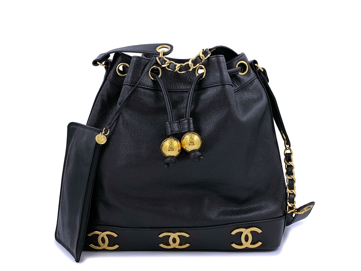 Chanel black bucket bag with logo on the front and gold detail