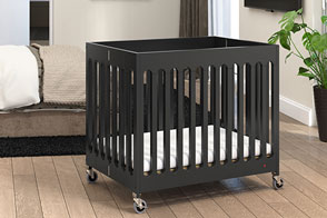 Foundations Boutique Compact Folding Crib - Upscale mini crib ideal for hotels, vacation rentals, and small living spaces. Available in 5 modern finishes.