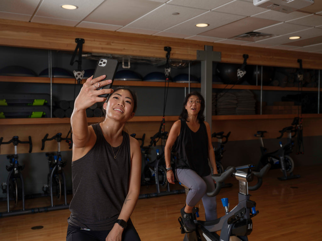 Taking a picture with mom while indoor cycling