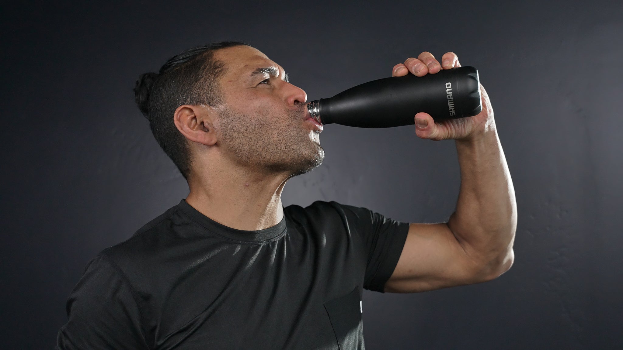 Drinking water from a Shimano indoor cycling bottle