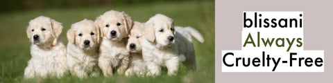 4 Puppies in a green field "blissani Always Cruelty-Free"