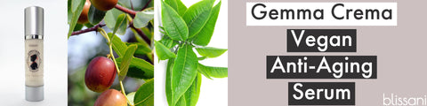A bottle of Gemma Crema, A jojoba nut, Green tea leaves "Gemma Crema Vegan Anti-Aging"