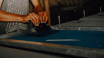 boy working in the screen printing company