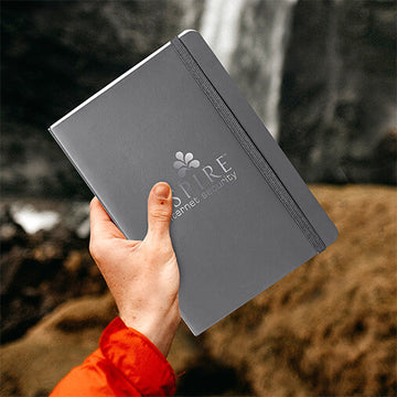 boy holding heat press journal notebook