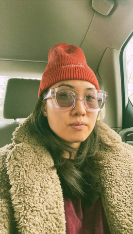 Girl wearing her LENNY red bleach dyed beanie in a cab.