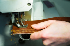 Sewing machine with leather shoe fabric