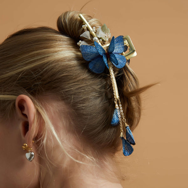 Transform your hairstyle into a mesmerizing garden with our Blue Butterfly Flower Garden Hair Claw. 