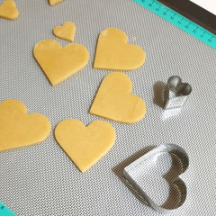 Image of small heart cookies made as cookie cake toppers