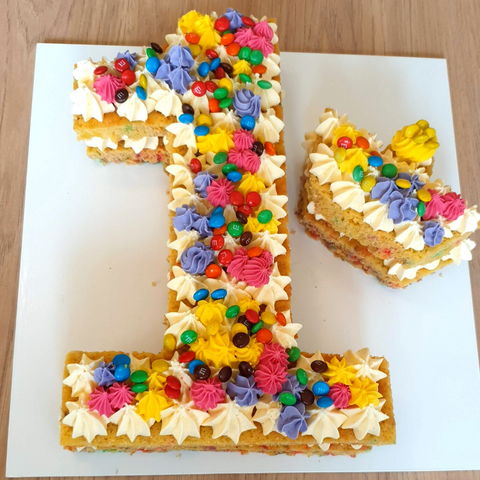 Image of number 1 layer funfetti cake with smaller crown cake.