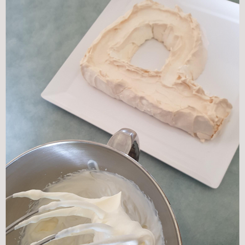 Letter Shaped Pavlova Ready For Decorating