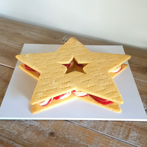 Image of ice cream sandwich large made from shortbread, vanilla ice cream and raspberry sorbet