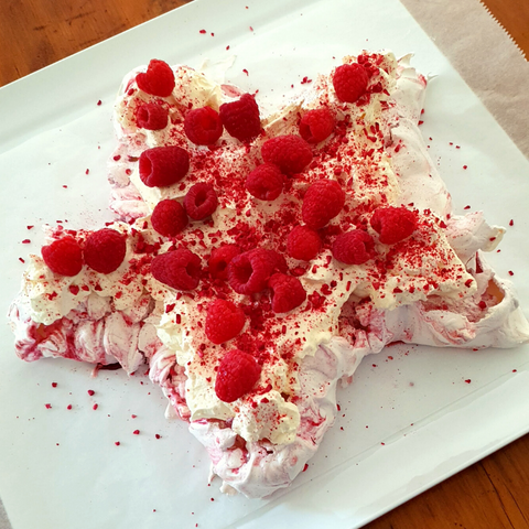 Image of star shaped pavlova with raspeberry swirl