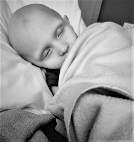 andrew at Ronald McDonald House New York with Casey mom sleeping under the covers