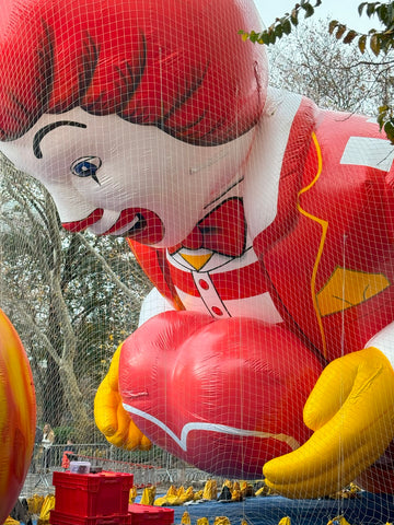 Ronald McDonald balloon head inflated on the ground