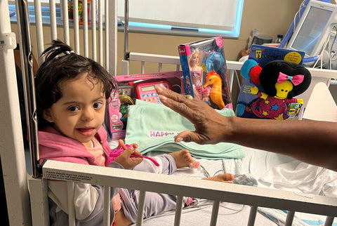 :Little girl in the NICU with toys from Ronald McDonald House New York