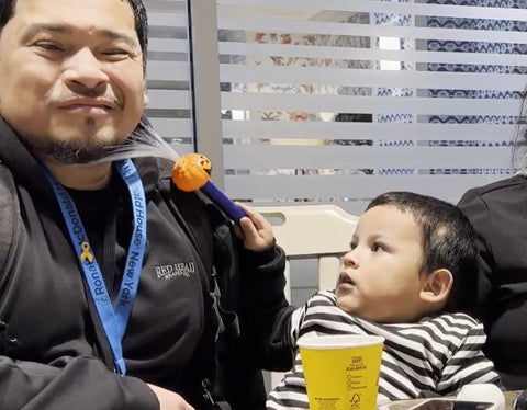 Elias tortures Dad with a Halloween prize from RMH-NY