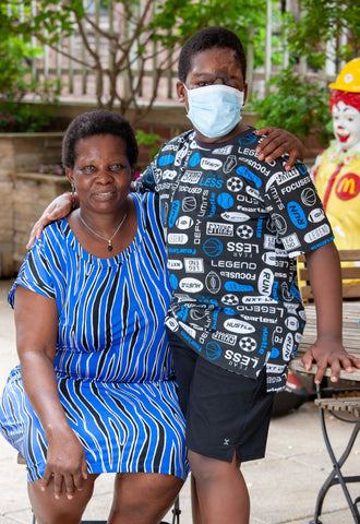 Rodwell and Shamiso on the 3rd floor terrace at Ronald McDonald House New York in new clothes