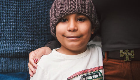 Oliver with family in a beanie at RMH-NY