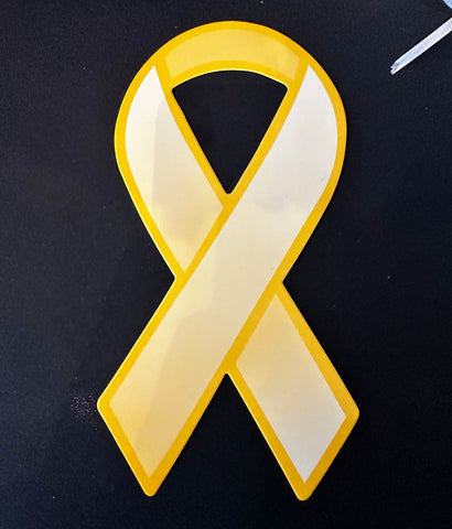 The golden ribbon of Childhood Cancer Awareness Month