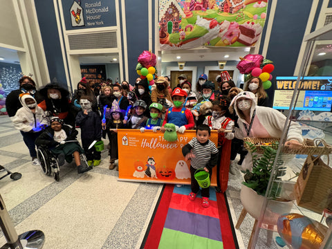 The Group poses for a picture in the RMH-NY Lobby before the Therapy Dog halloween parade began