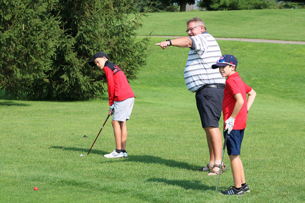 Junior Golfers with Coach