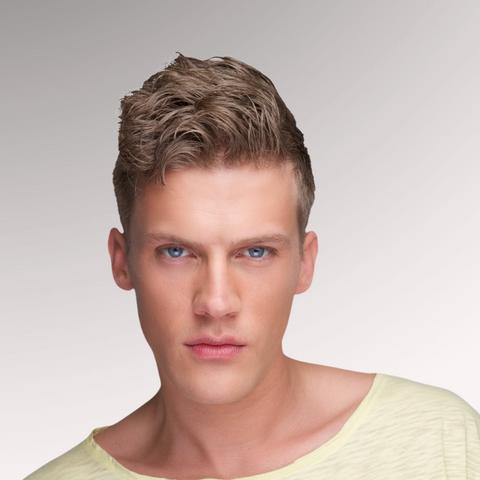 Gentleman in a yellow shirt demonstrating a short wavy hairstyle for men who have a wavy hair type