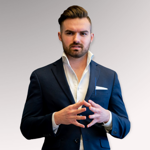 Gentleman in a blue suit demonstrating a side swept hairstyle for men with straight hair