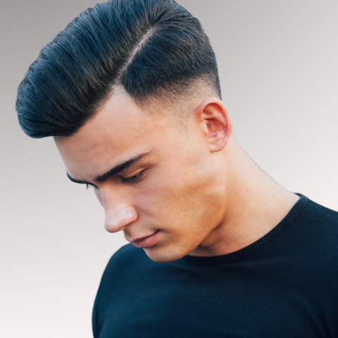 Gentleman in a black shirt demonstrating a straight hairstyle for men who have straight hair types