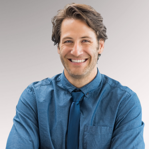 Man in a blue shirt and tie demonstrating a Bro Flo professional hairstyle for men