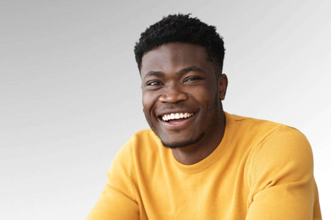 Hair cream for men model displaying a short style with kinky hair type