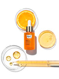 Image of MULTI CORREXION® Revive And Glow Daily Serum with product swatch, glass dropper and orange slice