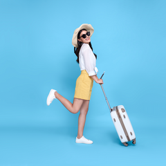 RoC Travel Skincare Woman in Yellow Shorts with Suitcase