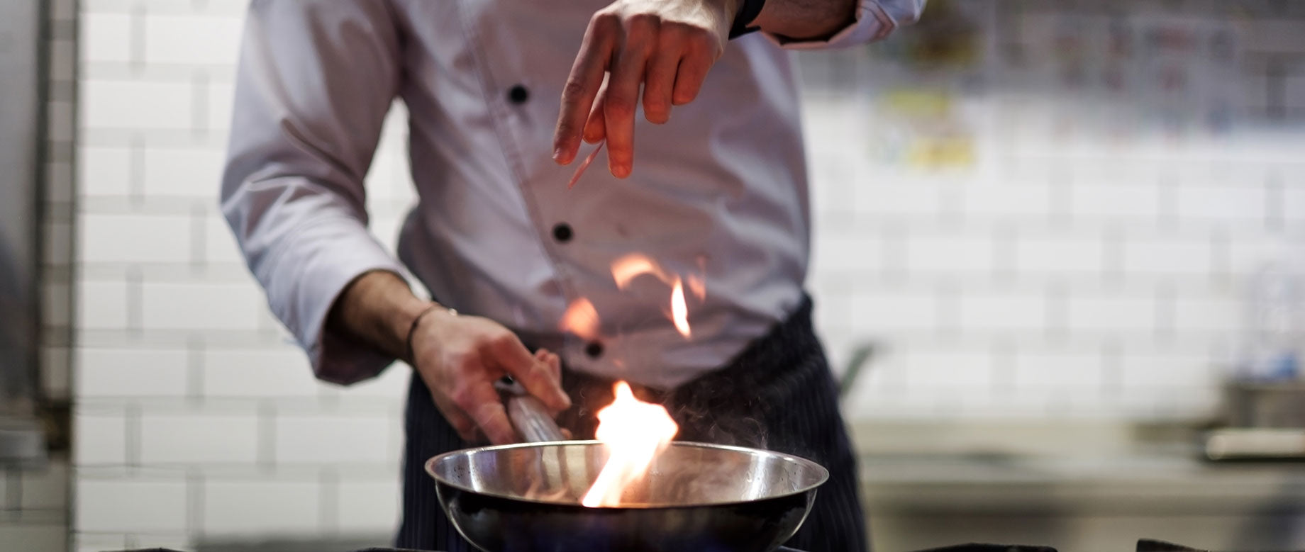 Cooking with cookware over stove