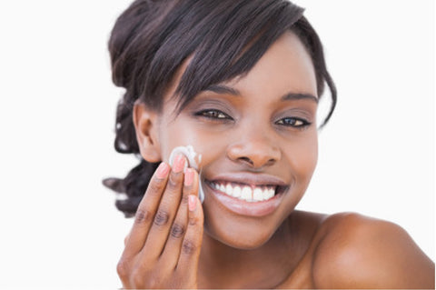 beautiful woman applying face cream