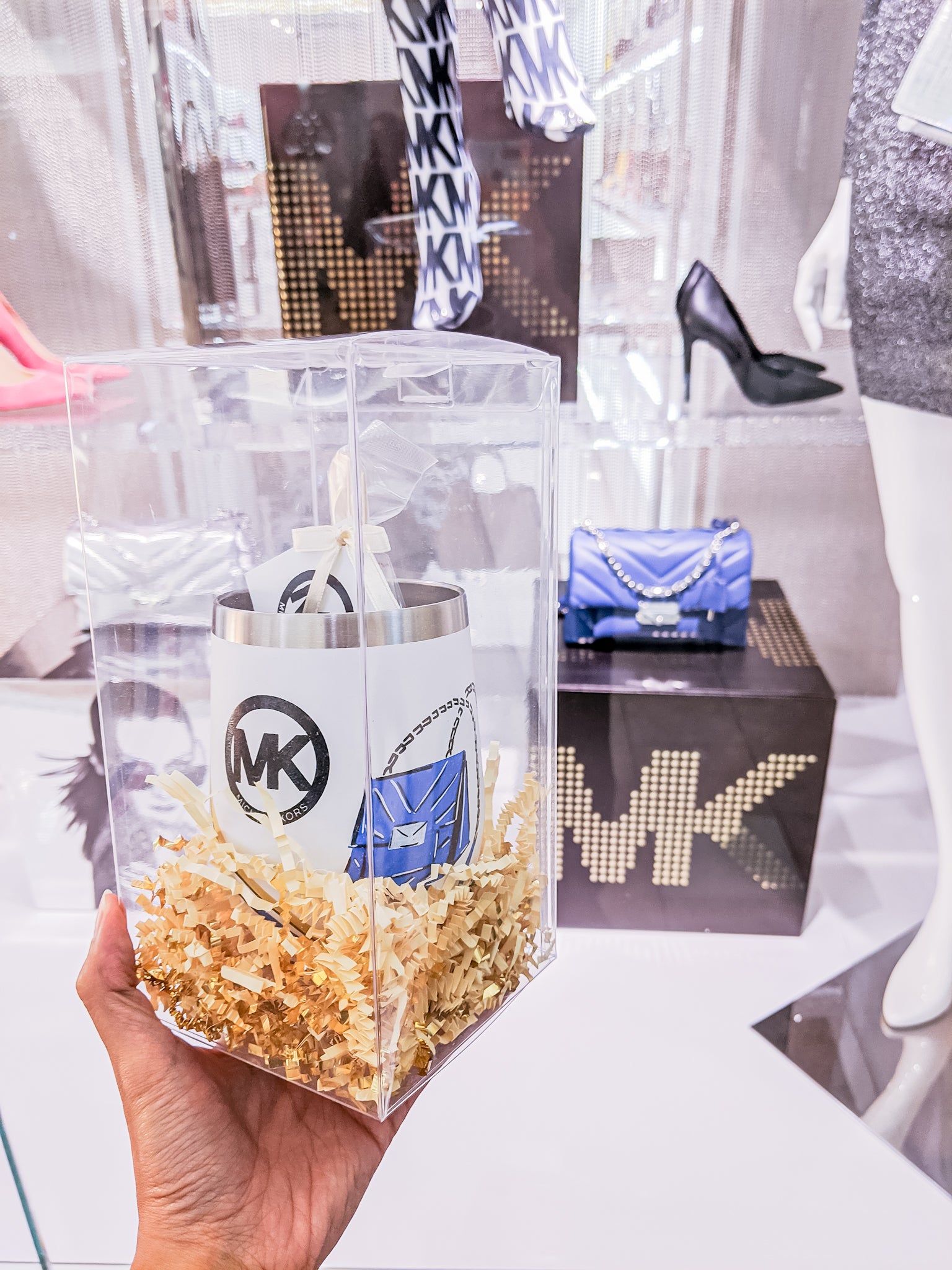 Curated Dry Goods for Michael Kors thermos on display in front of the Palm Beach retail store windows