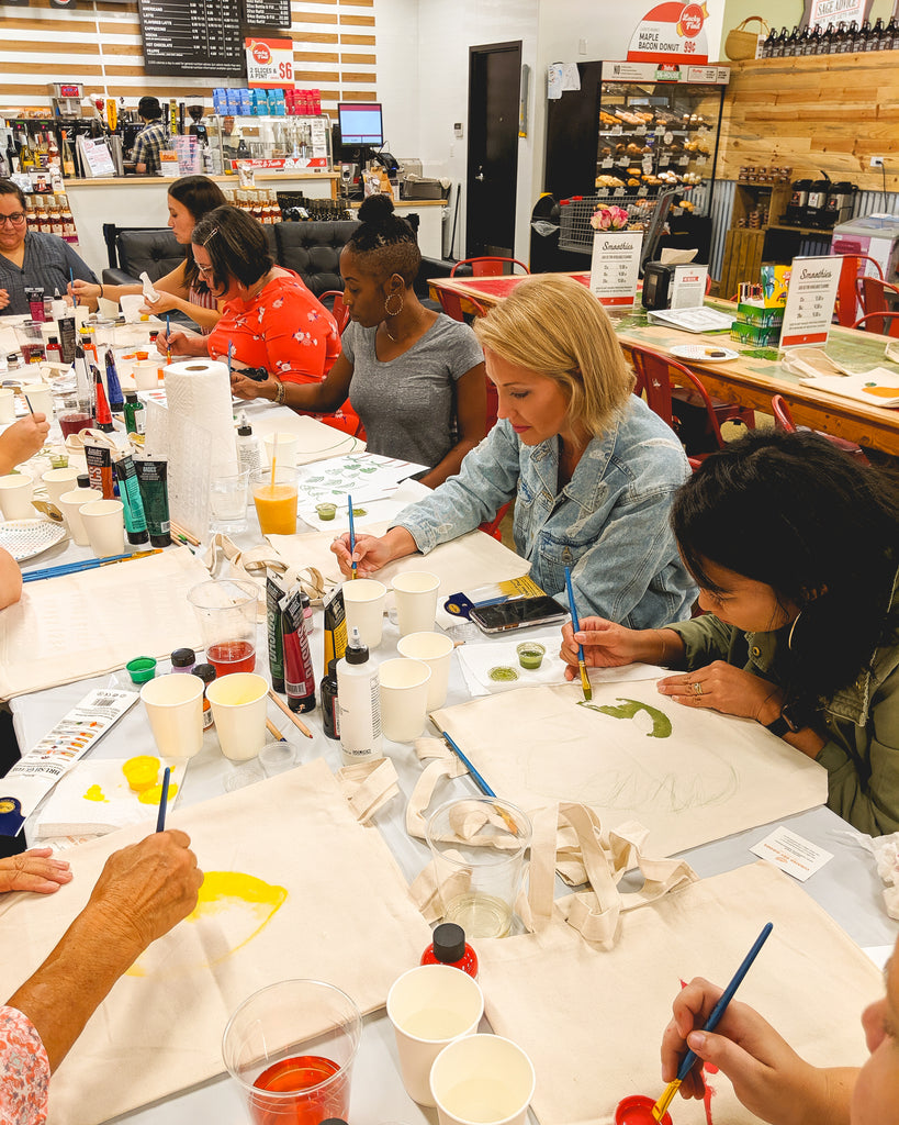 Canvas tote bag painting class at Lucky's Market Winter Park with Curated Dry Goods and Enlighten Us