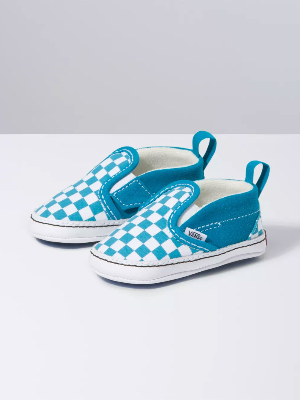 blue and checkerboard slip on vans