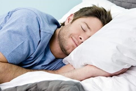 A Man Comfortably Sleeping on His Newly Bought Memory Foam Mattress