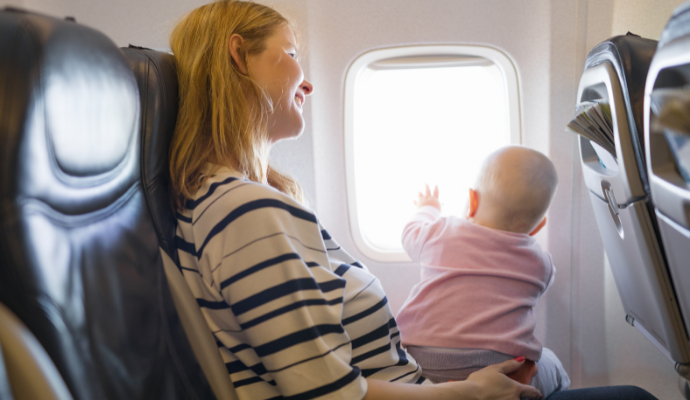 Could my baby sit on my lap during the flight?