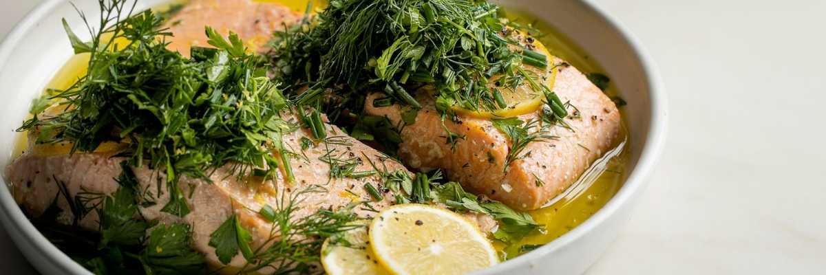 salmon baked in olive oil with citrus and herbs