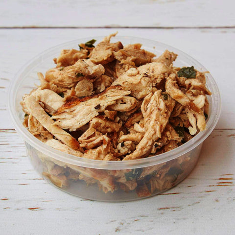 chicken leftovers placed in a plastic food container to be reheated 