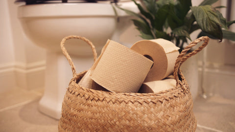 a basket of undyed, unbleached, Naked Sprout toilet rolls