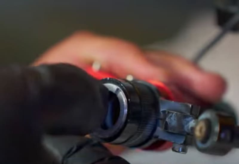remove the retaining ring from the laser nozzle