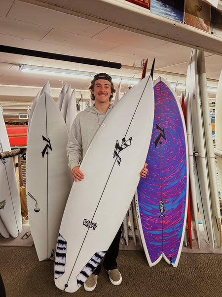 Photo of someone holding what? model surfboard