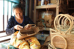 An authentic rattan bags sold in Ganapati Crafts Co. is being woven by a Indonesian woman